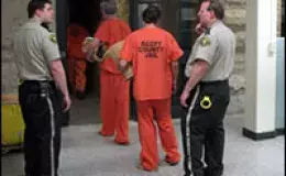 Inmates being let into the jail by correction officers.