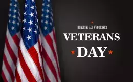 This says Honoring Those Who Served Veterans Day and has three American flags.