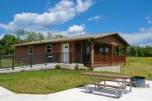 An front angled view of Summit Cabin 1 on a sunny day.