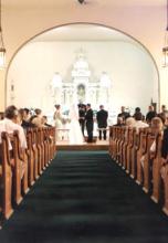 Picture of a wedding ceremony inside Olde St. Ann's Church.