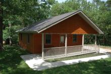 Front view of Kestrel cabin with ramp sidewalk and porch.