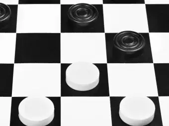 black and white checker board with black and white checker pieces