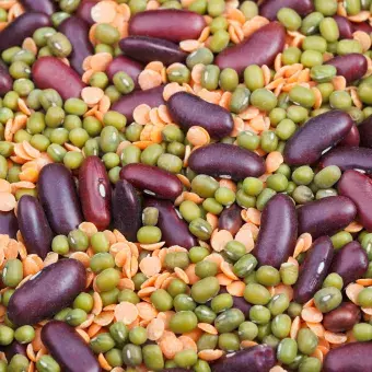 mixture of dried beans that are purple, green and beige