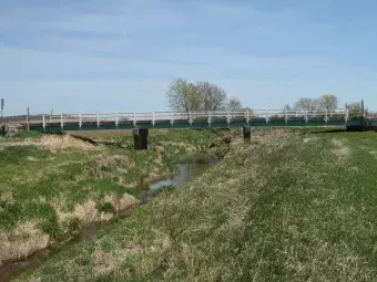 Image of the bridge crossing the creek.