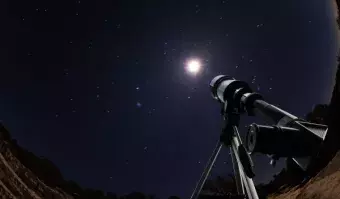 Telescope looking up at the night sky