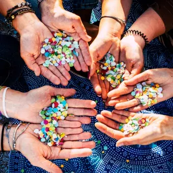 Hands of people with beads in their hands