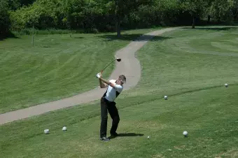 Golfer preparing swing.
