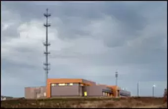SECC building with overcast clouds.