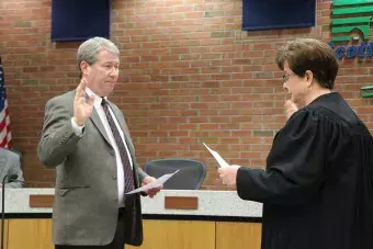 Swearing in Attorney Michael Walton.