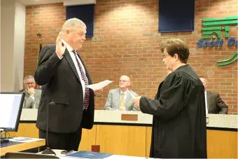 Swearing in Supervisor John D. Maxwell.