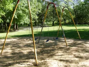 Swings located near the shelter.