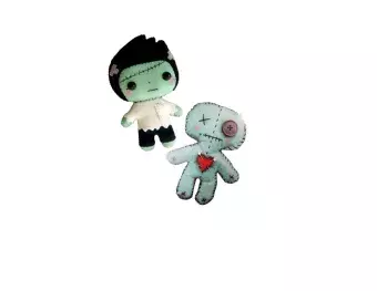 stitched creatures with felt and thread and needle