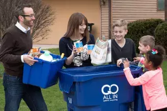 Neighborhood comes together to recycle around new cart.