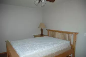 A bedroom at Summit Cabin with a queen bed. ADA Accessible.