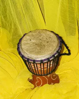 hand drum on a yellow background