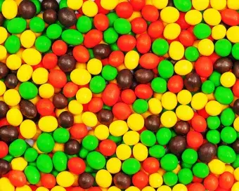 Multi colored candies for use as background. Closeup.