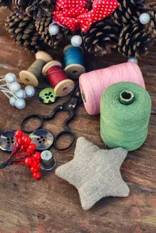 Tools of crafts like buttons and thread to use in Christmas decoration