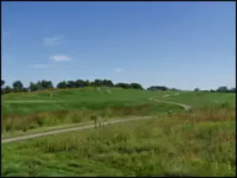 The rolling hills of the golf course.