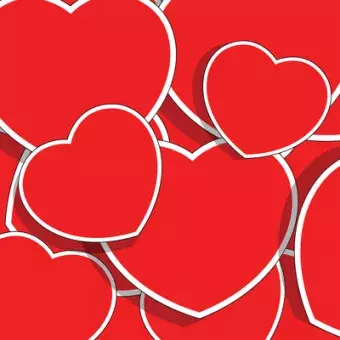 Pile of red hearts of various sizes.