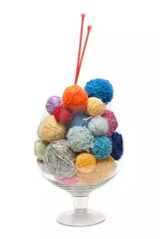 Balls of yarn with knitting needles