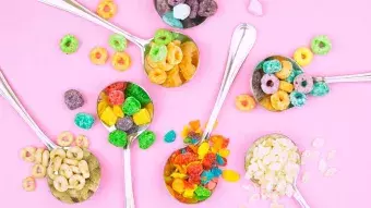 Spoons of cereal--including Cheerios and Fruit Loops