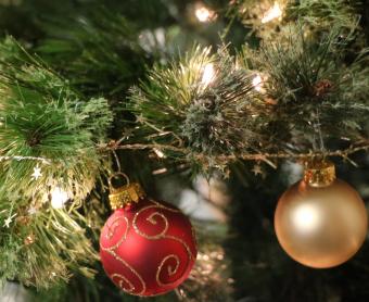 Holiday iights and ornaments on a tree.