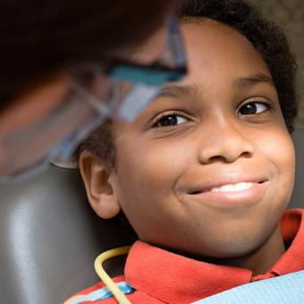 Child receiving dental screening