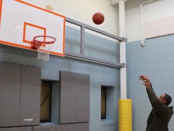 Harlee Miller shoots a basketball.