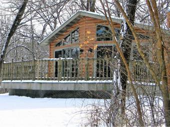 Pine Grove Cabin covered in the snow during winter.