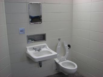 A jail cell toilet and sink facilities.