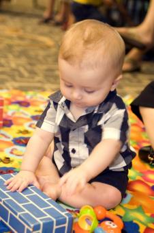 A baby playing with some toys.