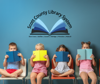 This is a picture of four kids holding books in front of their faces with the SCLS logo above.