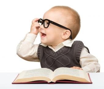 This is a picture of a baby with a book 
