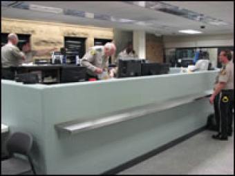 Booking officers at the booking desk.