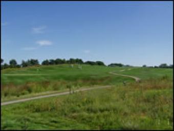 The rolling hills of the golf course.