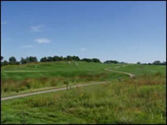The rolling hills of the golf course.