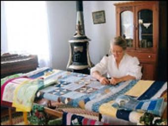 Woman quilting.