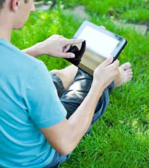 This is a picture of a boy using a tablet