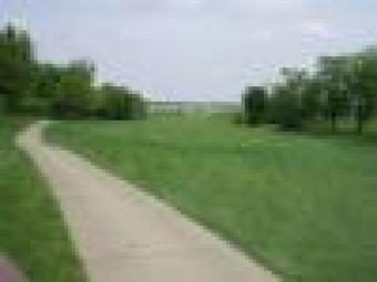 photo of golf cart path and golf course