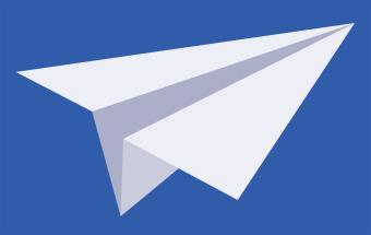 image of white paper airplane with blue background