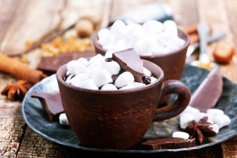 mug of hot chocolate with marshmallows and chocolate pieces