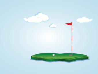 clouds, blue background, and a flag on a golf course with a golf ball