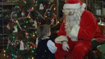 Little girl speaking to Santa.