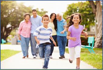 Image of a family out for a walk together, children running ahead