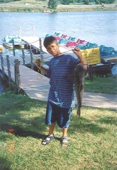photo of a Kid with a big fish