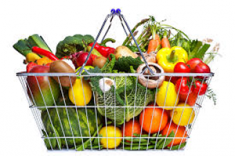 Grocery basket full of healthy fruits and vegetables.