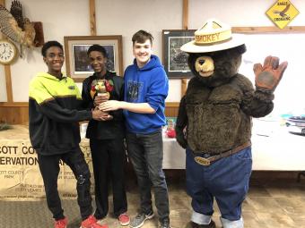 photo of chili cook off winners with smokey the bear