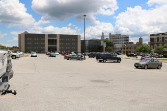 The Scott County Courthouse parking lot with a spattering of cars.