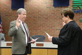 Swearing in Attorney Michael Walton.