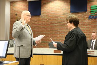 Swearing in Supervisor Ken Croken.